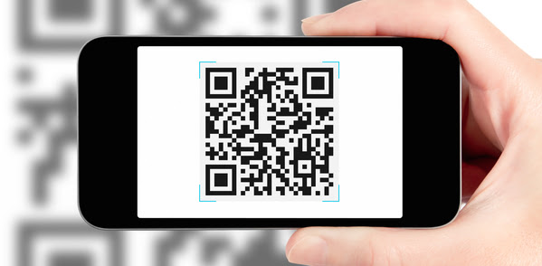 Scanning QR code with mobile smart phone. Isolated on white.