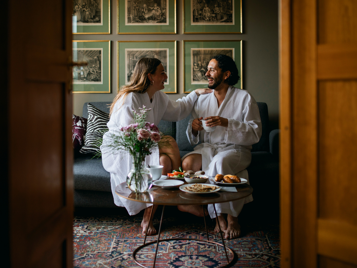 Image of guests enjoying hotel room service