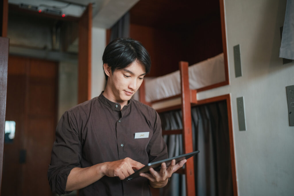 Hotel housekeeping staff using app on tablet