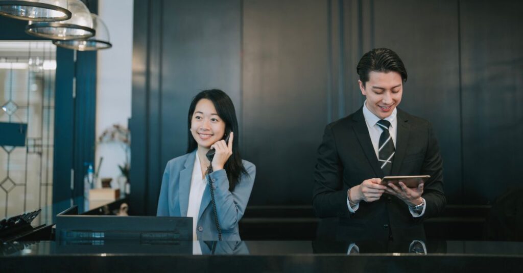 Hotel staff smiling and working