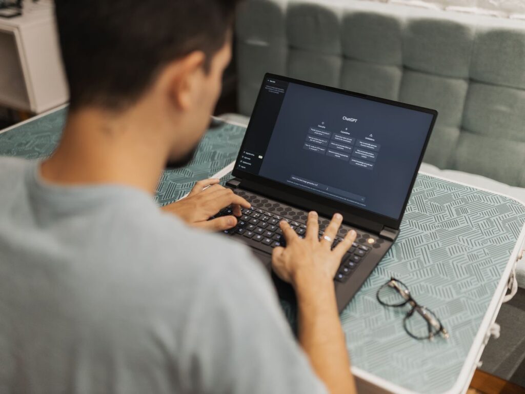 Man using ChatGPT on laptop